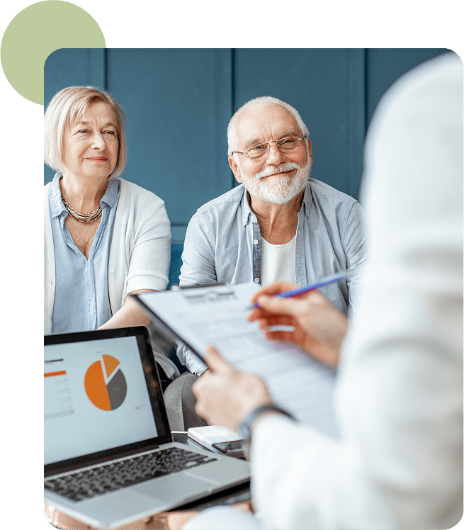 Smiling senior couple reviewing finances